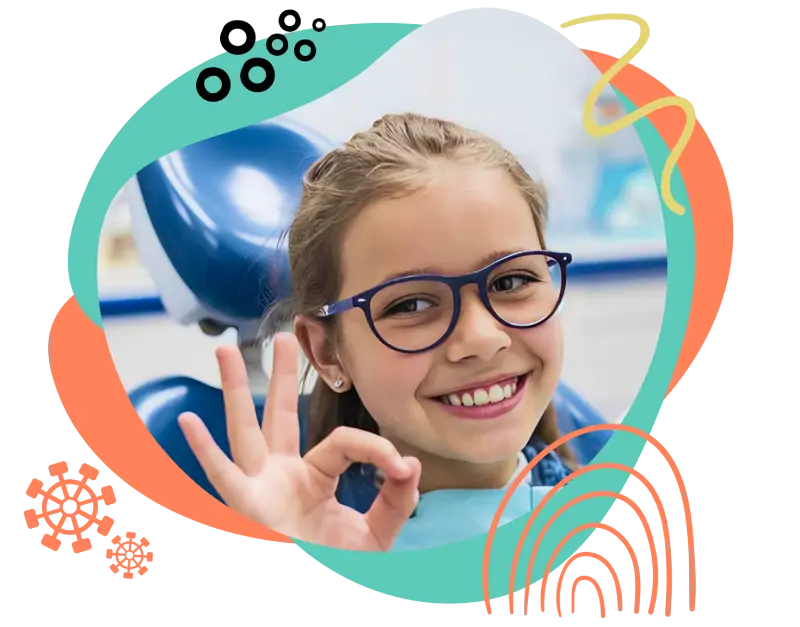 Smiling young girl wearing glasses showing an OK sign during a dental visit at East End Tooth Ferry pediatric dentist in Southampton, New York.